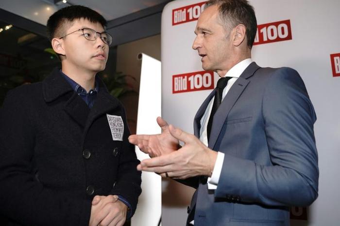 Beijing reacted angrily to the meeting between Hong Kong pro-democracy activist Joshua Wong (L) and German Foreign Minister Heiko Maas