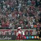 Olympiakos players and fans celebrate Mathieu Valbuena's equaliser against Tottenham