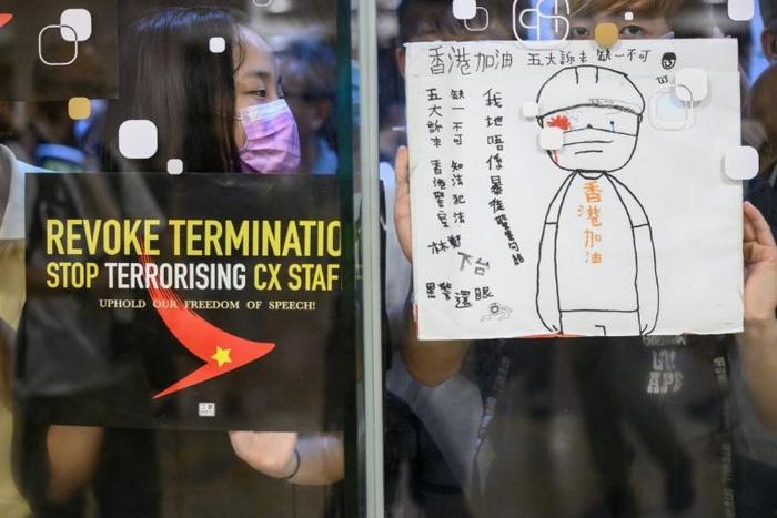Airliner Cathay has been put in a bind over whether to allow its staff to take part in demonstrations