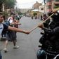 Bolivian pro-government supporters clash with riot police during a rally for President Evo Morales in Cochabamba