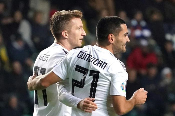 Manchester City midfielder Ilkay Gundogan (R) celebrates scoring twice in Germany's 3-0 win at Estonia on Sunday in a Euro 2020 qualifier