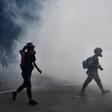 Clouds of acrid smoke wafted across streets usually packed with tourists, including outside the landmark colonial-era Peninsula Hotel, as protesters and police clashed