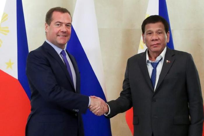 A spokesman for Philippine leader Rodrigo Duterte (right) defended his dishevelled appearance at a meeting with Russian Prime Minister Dmitry Medvedev (left) in Moscow