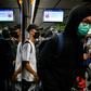 Protesters stood at doorways of trains, stopping them from closing, at a series of stations on the underground system