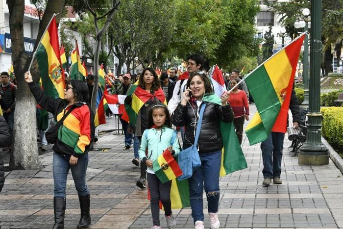 People take to the streets of La Paz to celebrate the resignation of Bolivian President Evo Morales on November 10, 2019