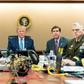 President Donald Trump and top staff monitor the Syria raid on live video from the Situation Room in this White House handout
