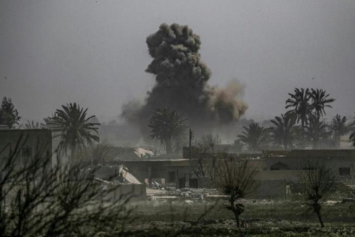 Smoke plumes billows after shelling of the Islamic State (IS) group's last holdout of Baghouz in eastern Syria near the border with Iraq