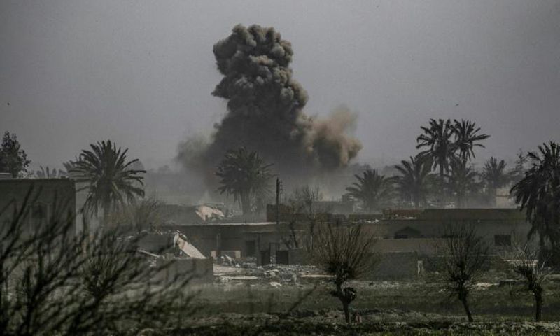 Smoke plumes billows after shelling of the Islamic State (IS) group's last holdout of Baghouz in eastern Syria near the border with Iraq