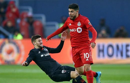 Toronto FC's Alejandro Pozuelo, evading a tackle attempt by DC United's Paul Arriola, has sparked the Canadian MLS squad in the wake of an injury to Jozy Altidore