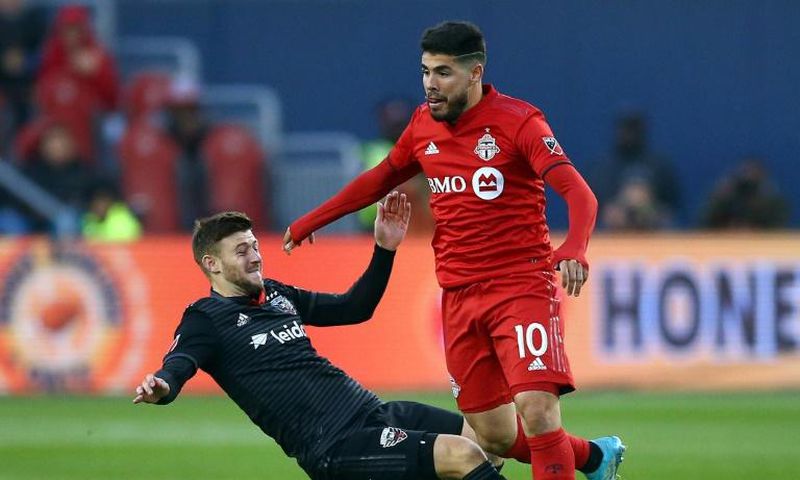 Toronto FC's Alejandro Pozuelo, evading a tackle attempt by DC United's Paul Arriola, has sparked the Canadian MLS squad in the wake of an injury to Jozy Altidore