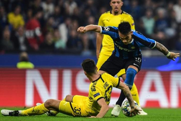 Inter Milan forward Lautaro Martinez (R) scored the opener against Dortmund.