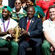 South African President Cyril Ramaphosa holds the Rugby World Cup trophy with Springboks captain Siya Kolisi