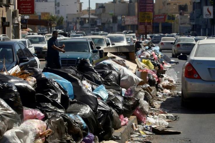 Across Libya's capitol Tripoli, tonnes of waste overflows from bins and piles up on roadsides