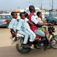 Room for one more? A traditional motorcycle taxi on Lagos roads -- overladen and not a crash helmet in sight