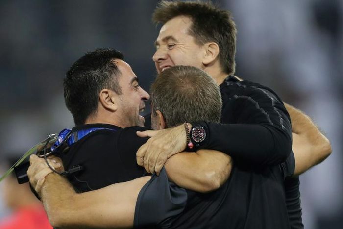 Sadd SC's Spanish coach Xavi Hernandez celebrates with his staff after his team's 3-1 AFC Champions League quarter-final football match victory against Saudi's Al-Nassr at the Jassim bin Hamad Stadium in Doha on September 16, 2019.