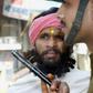 For decades Hindus and Muslims have been bitterly divided over the 16th-century Babri mosque - here a sadhu, a Hindu holy man, is stopped from entering the disputed site in March 2002