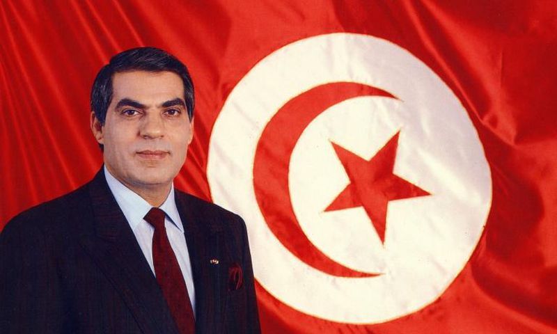 A picture released in April 1998 of Tunisia's ousted president Zine el-Abidine Ben Ali posing for an official picture in front of the Tunisian flag