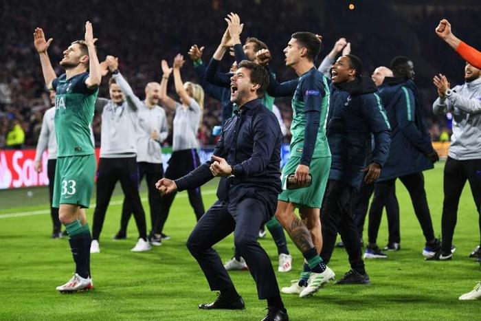 Time to go again: Tottenham players manager Mauricio Pochettino (centre) celebrated a famous Champions League semi-final win at Ajax in May