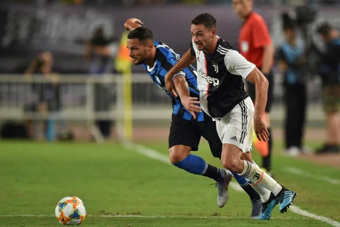 Juventus's Mattia De Sciglio (R) has been replaced by Inter Milan's Danilo D'Ambrosio (L) for Italy's Euro 2020 qualifiers