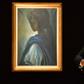 Nigerian author Ben Okri poses last year with Ben Enwonwu's 'Tutu' known as the 'African Mona Lisa'