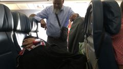 ‘Romantic’ man stands in a flight for 6 hours to watch over sleeping wife