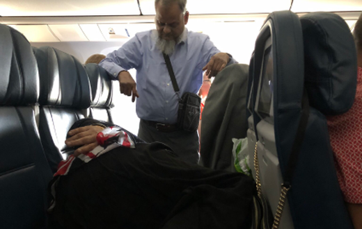 ‘Romantic’ man stands in a flight for 6 hours to watch over sleeping wife