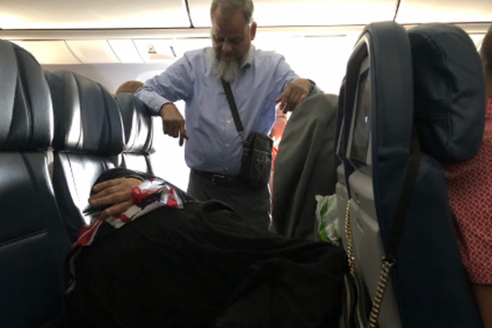 ‘Romantic’ man stands in a flight for 6 hours to watch over sleeping wife