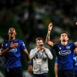 Famalicao players celebrate with fans after the club's victory over Sporting Lisbon on September 23