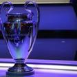 The Champions League trophy stands on display during the group stage draw ceremony
