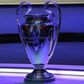 The Champions League trophy stands on display during the group stage draw ceremony