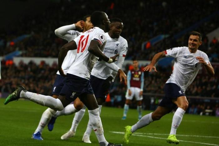 Liverpool's Sadio Mane (L) celebrates scoring the winner at Aston Villa