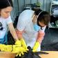 Biologists at a marine mammal rehabilitation center in Ceara State, Brazil, treating a turtle covered in oil