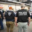 US Immigration and Customs Enforcement (ICE) and Homeland Security Investigations (HSI) officers execute search warrants on August 7, 2019, as part of a mass roundup of undocumented immigrants in the southeastern US state of Mississippi