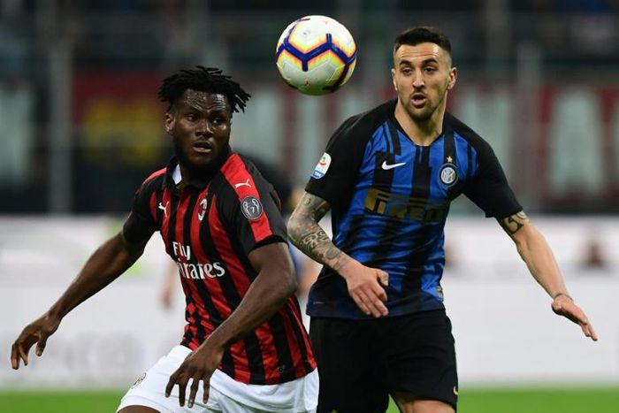 AC Milan's Ivorian midfielder Franck Kessie (L) was twice targeted by "racist chants" by Inter fans