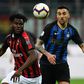 AC Milan's Ivorian midfielder Franck Kessie (L) was twice targeted by "racist chants" by Inter fans