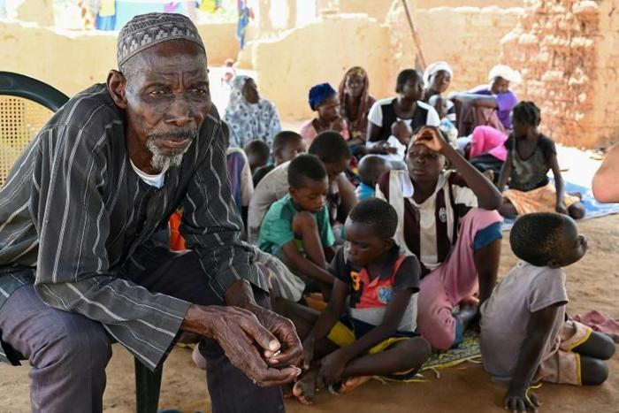 'We have swallowed our shame': Belen Boureima, 74, and members of his family