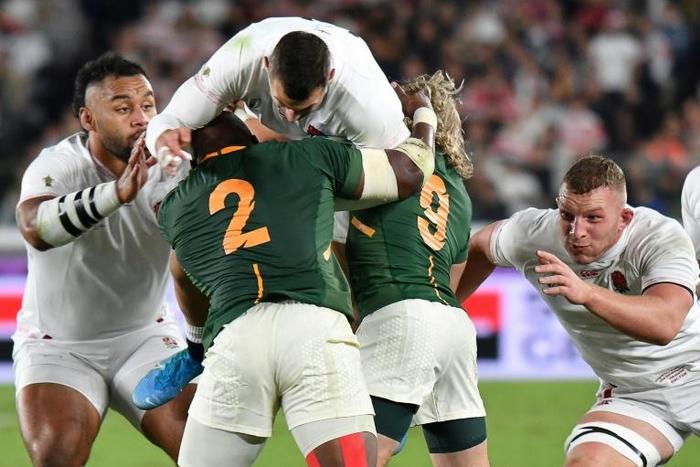 Hooker Bongi Mbonambi (No. 2) demonstrates the power of the the South Africa forwards by lifting England winger Jonny May during the 2019 Rugby World Cup final in Yokohama this weekend