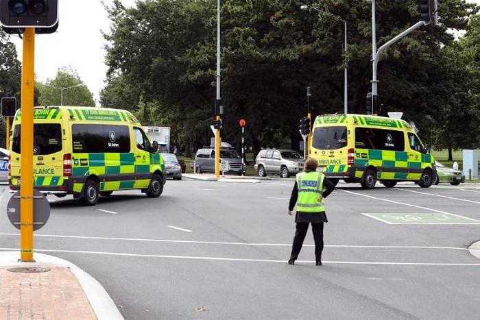 Ambulances rush towards one of the two mosques in Christchurch where a right-wing extremist armed with semi-automatic weapons rampaged during afternoon prayers