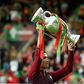 Portugal's forward Cristiano Ronaldo raises the EURO 2016 trophy