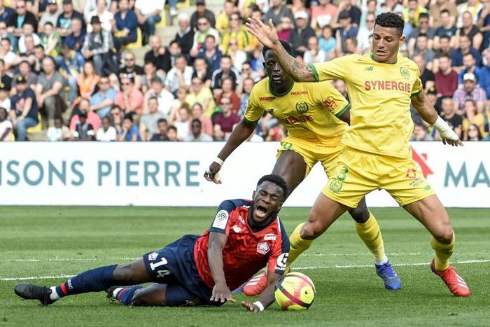 Jonathan Bamba is brought down for a penalty as Lille fight back for three points at Nantes
