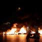 Protesters burned tyres as hundreds of people took to the streets in anger over a move to tax calls on messaging apps