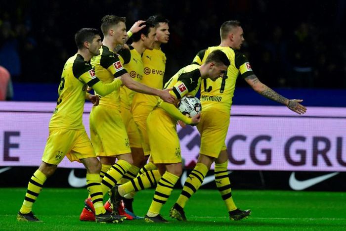 Borussia Dortmund captain Marco Reus (second from left) celebrates after their 3-2 win at Hertha Berlin on Saturday