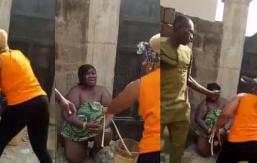 Wife flogs another woman she caught sleeping with husband, using her cloth as wrapper (video)