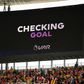 A scoreboard shows that VAR is checking a possible goal