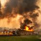 A building at a vineyard is engulfed in flames from the Kincade fire near Geyserville, California on October 24, 2019