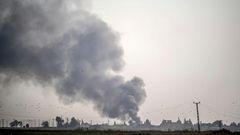 Smoke rises from the Syrian town of Tal Abyad after Turkish bombings