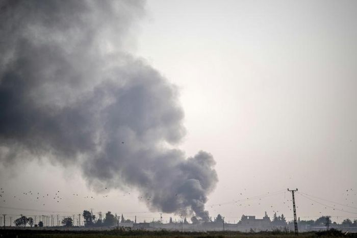 Smoke rises from the Syrian town of Tal Abyad after Turkish bombings