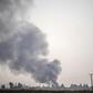 Smoke rises from the Syrian town of Tal Abyad after Turkish bombings