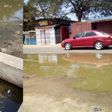 Waste water from the system seeps through the streets of Tema