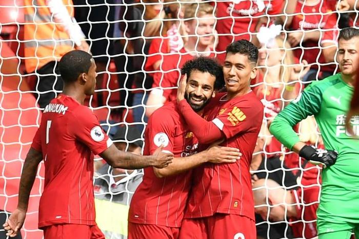Roberto Firmino (right) teed up Mohamed Salah (centre) for Liverpool's third goal against Newcastle